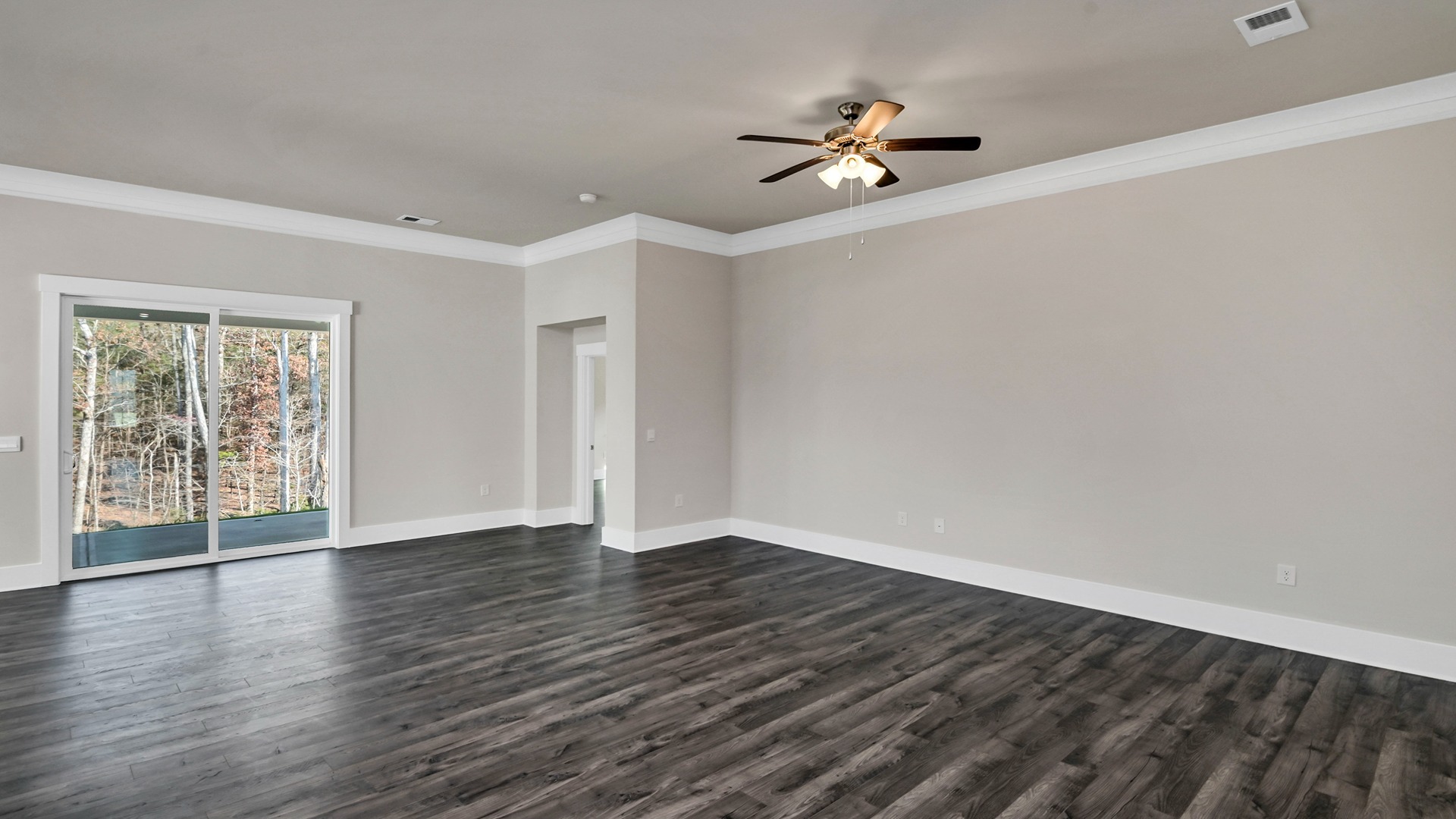 Living area with ceiling fan and Revwood flooring