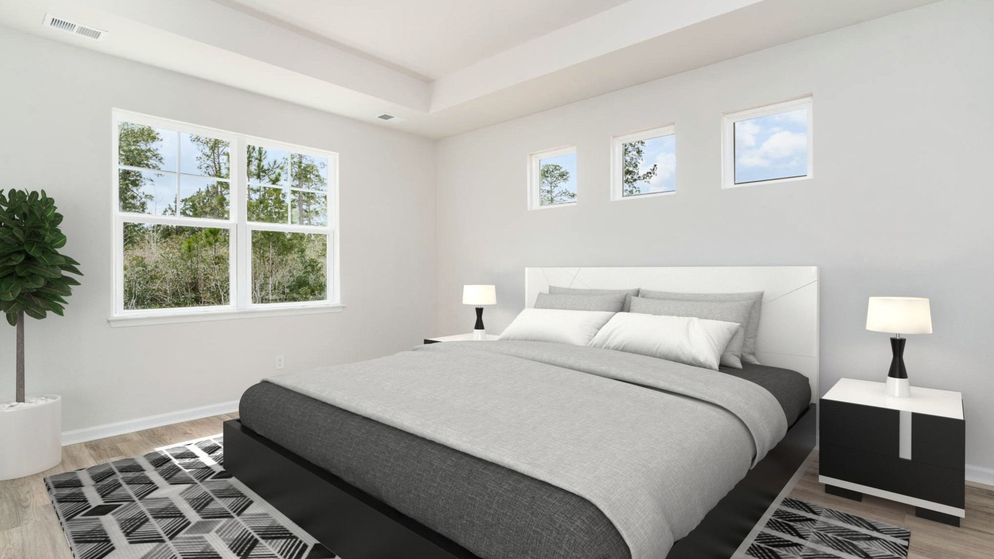 Furnished primary bedrooms with several windows.