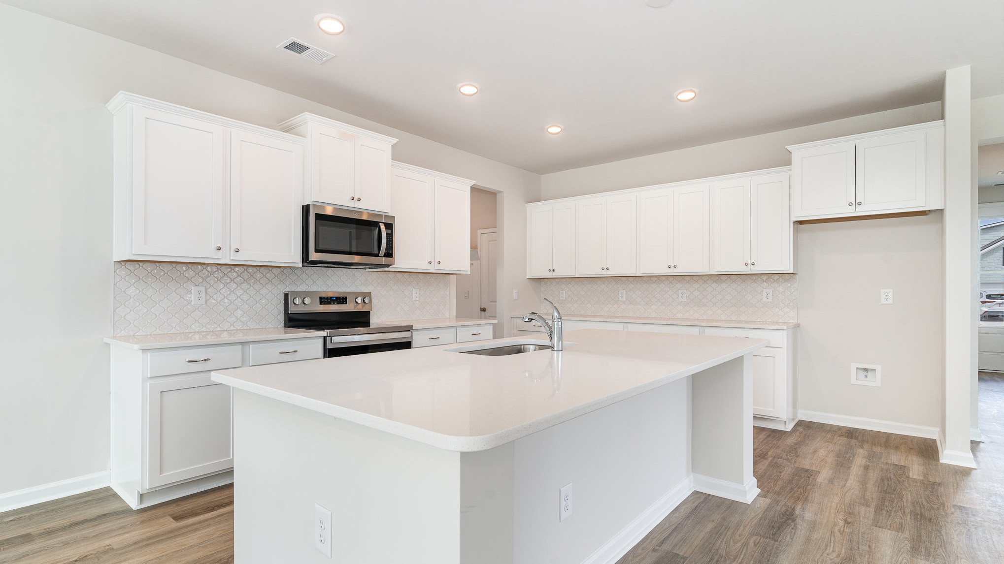 Tile backsplash will finish the kitchen space