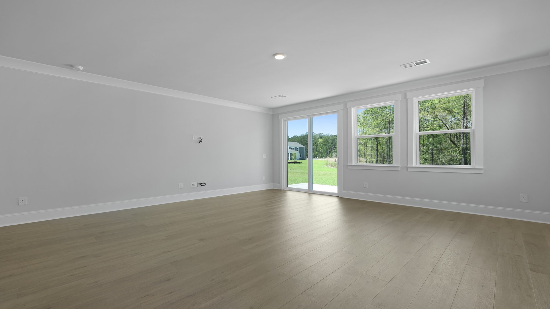 Access to back patio from living area through glass sliding doors