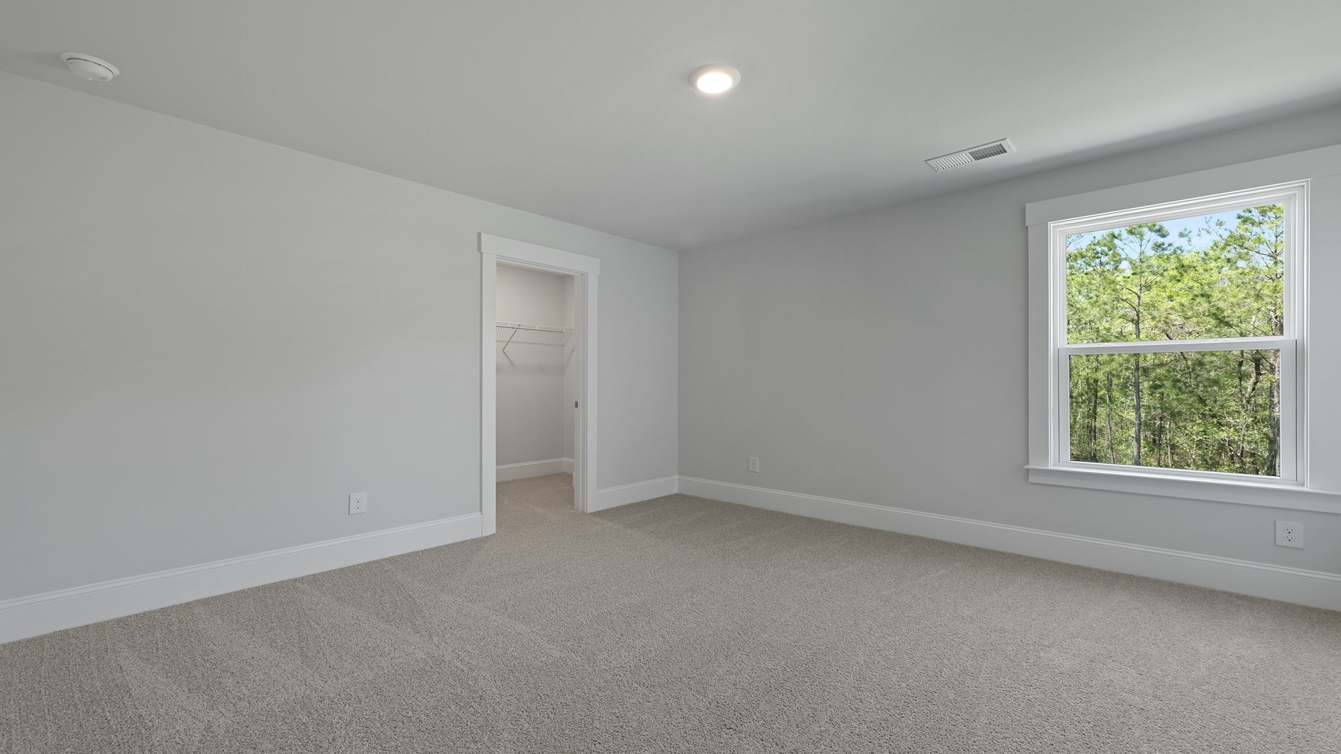 Bedroom 4 with a window and carpet flooring