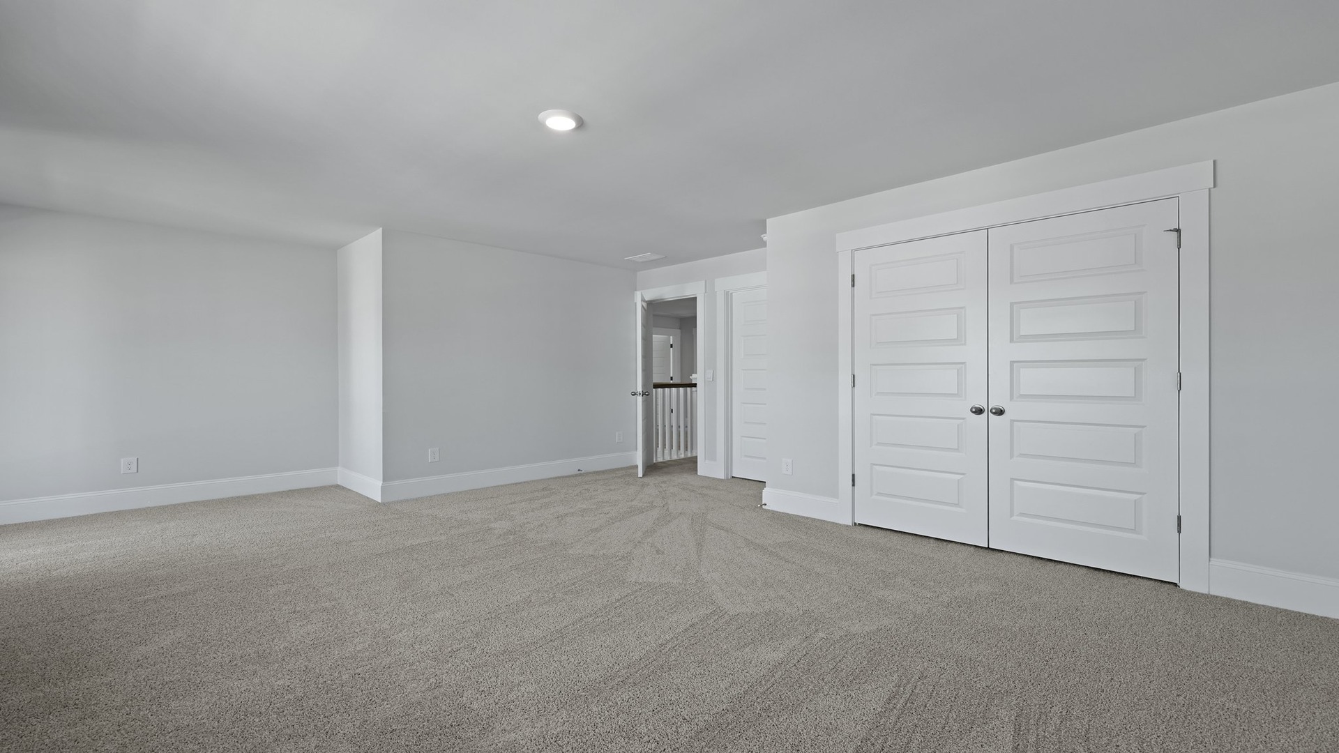 Bedroom 2 with French closet doors and walk-in closet