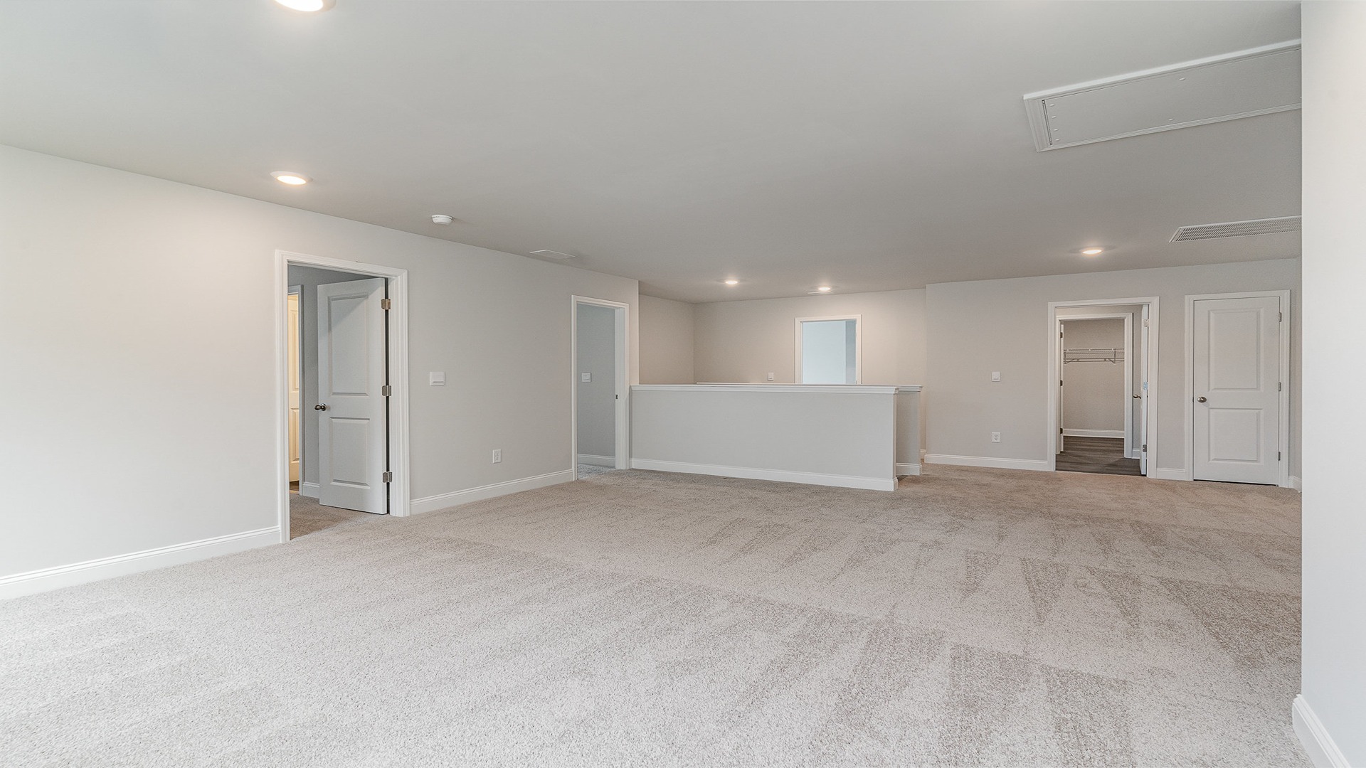 Spacious upstairs loft area with ample natural light