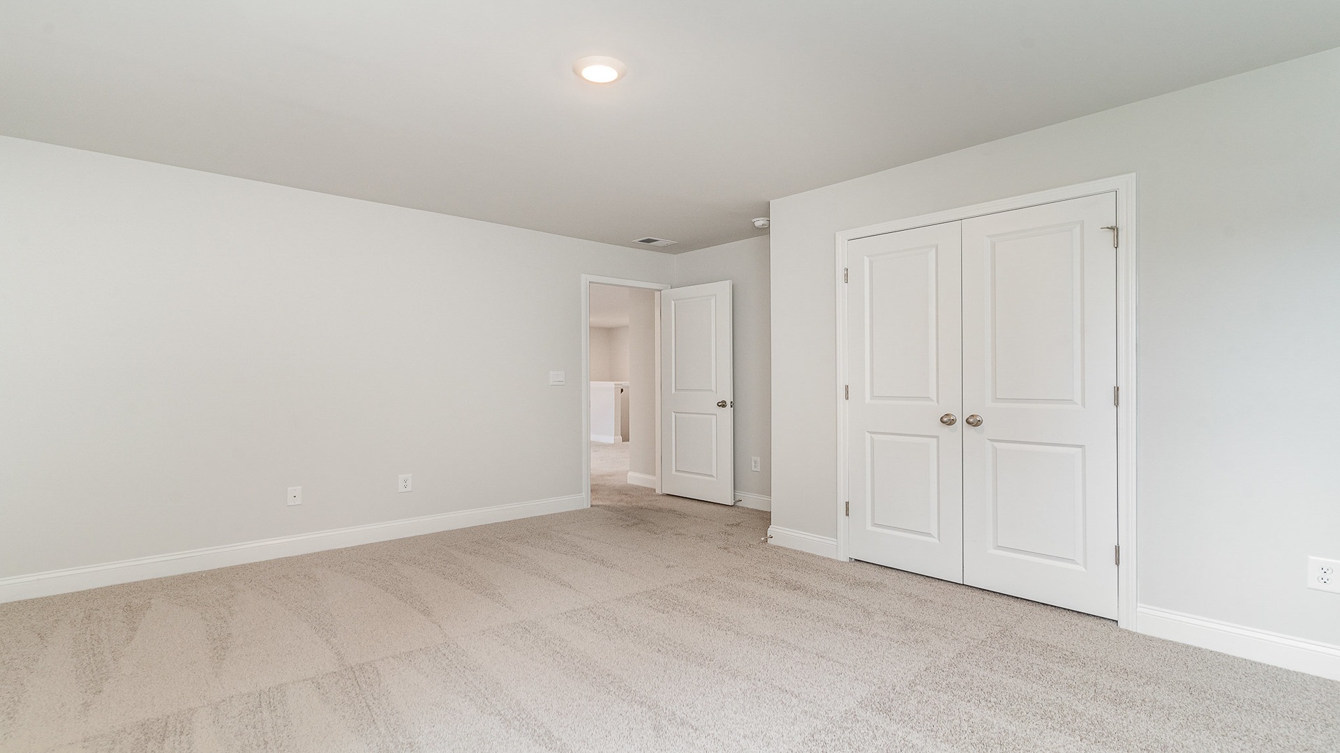 Bedroom 2 upstairs with French closet doors