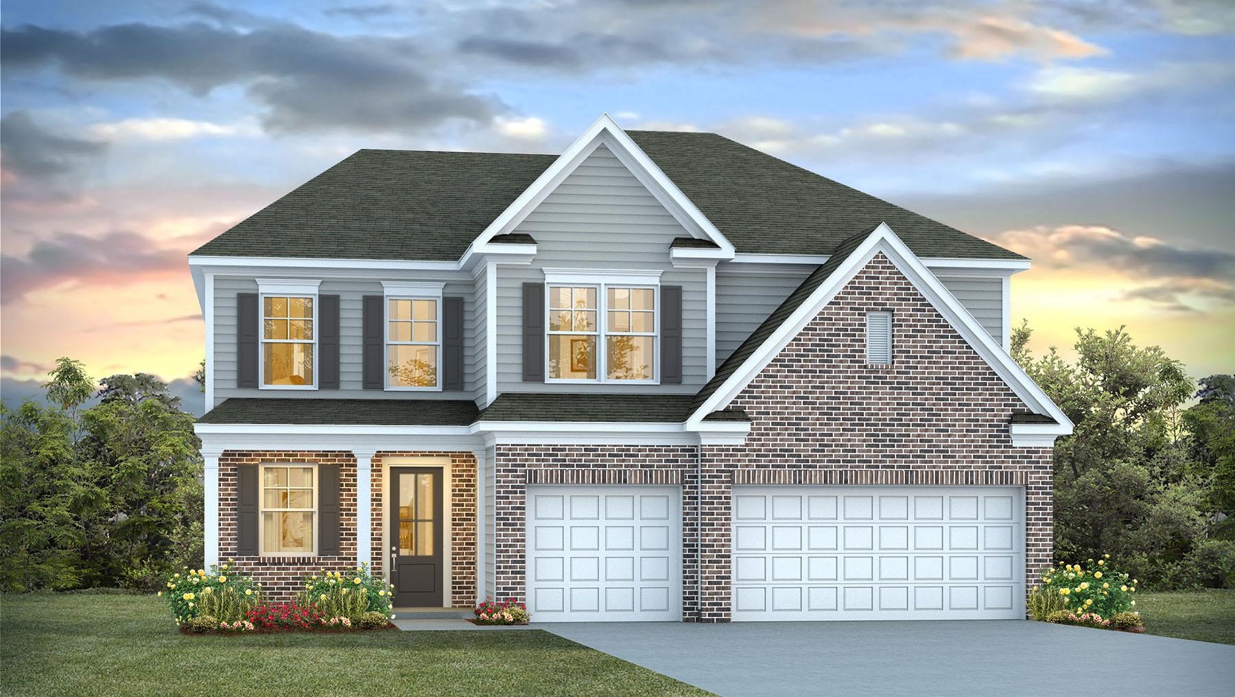 Two-story home with a 3-car garage and partial brick exterior.