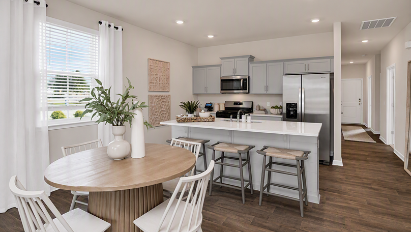Front foyer of new construction home opens up into the kitchen area
