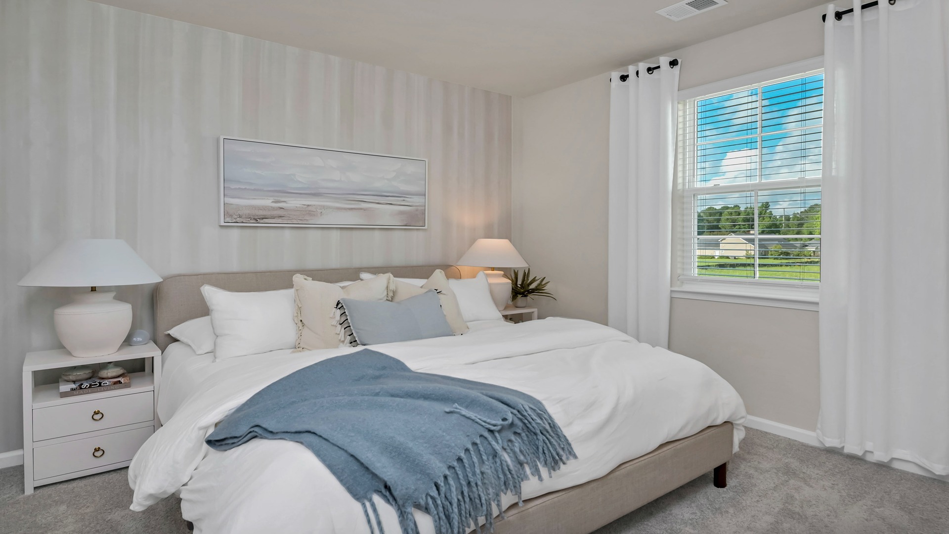 Spacious primary bedroom at back of home