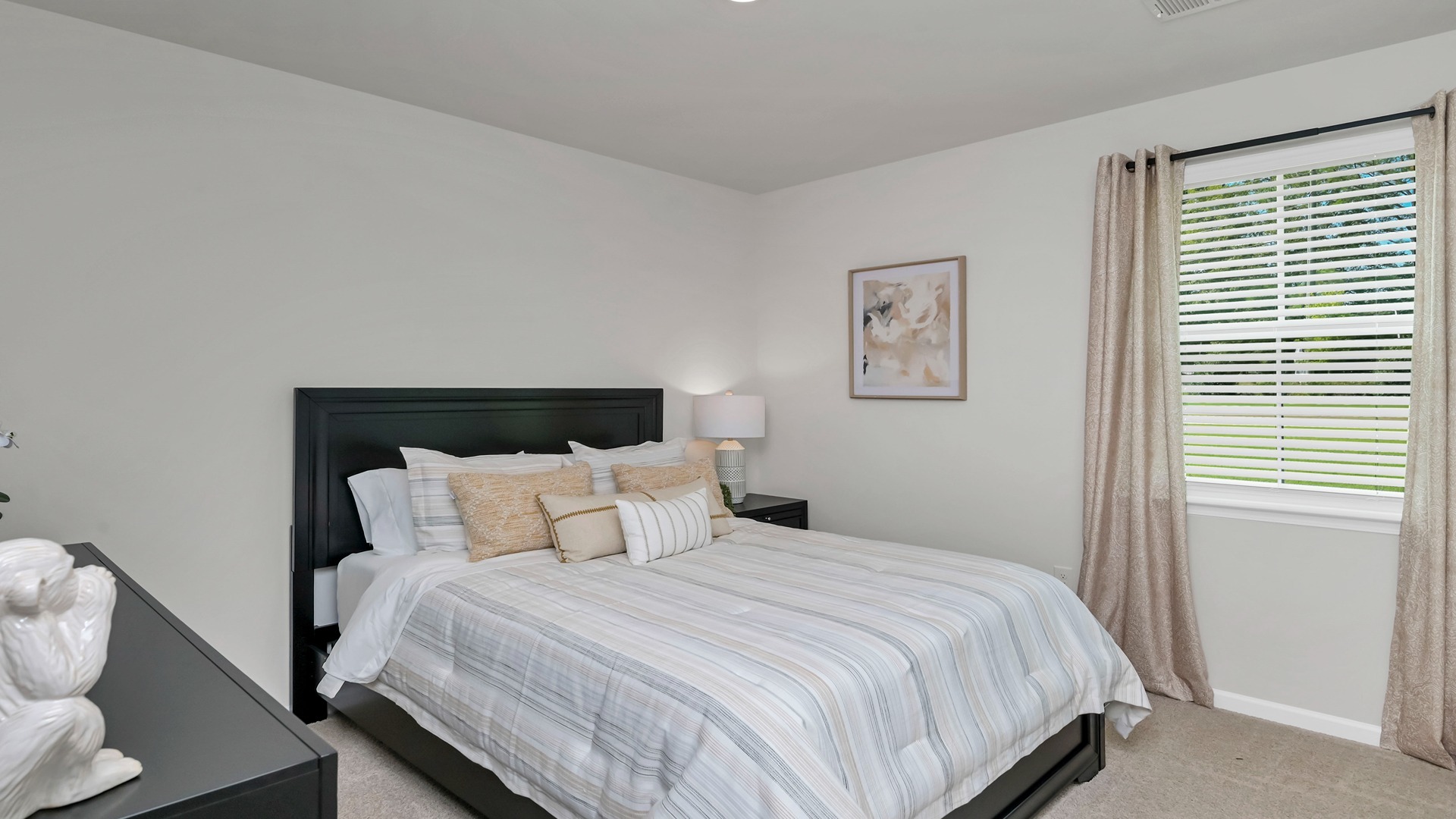 Bedroom 4 with carpet flooring and a window