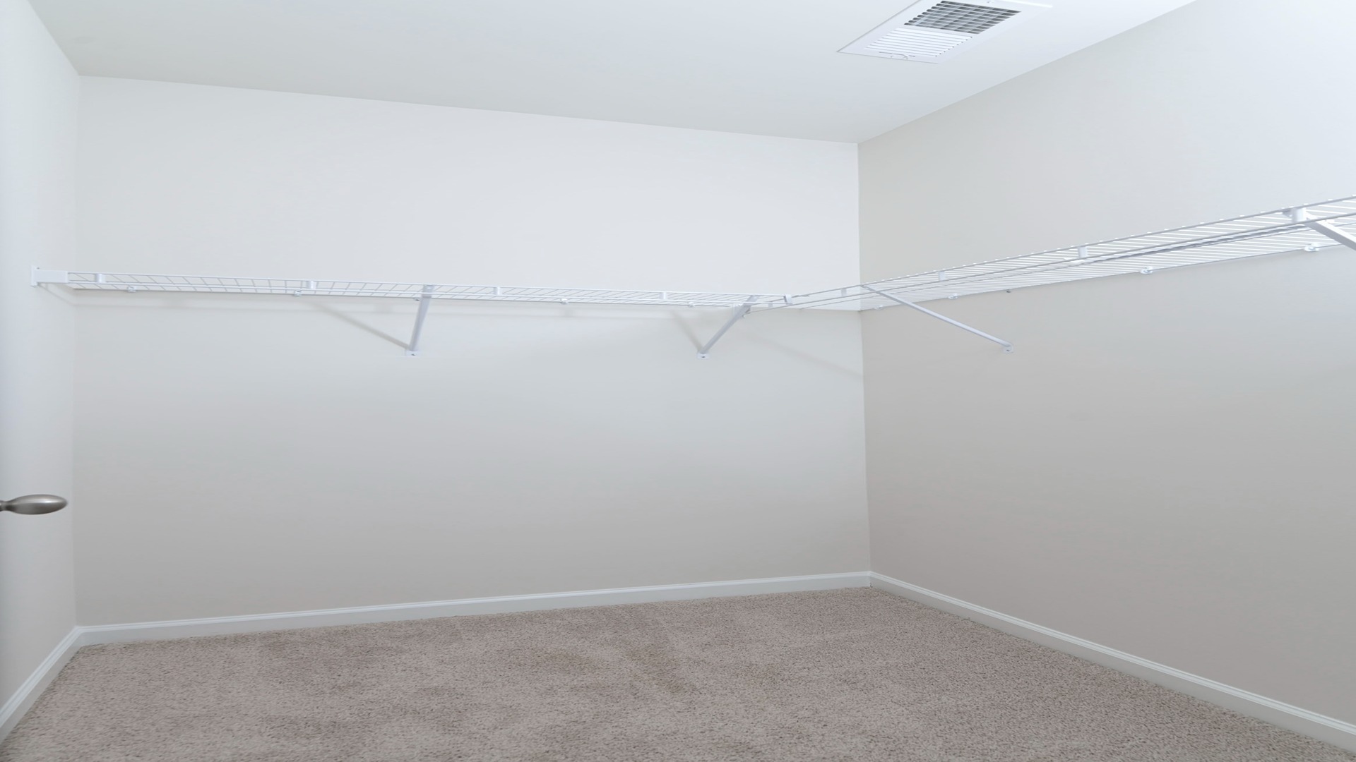 The Primary bedroom is spacious with several windows for natural light.