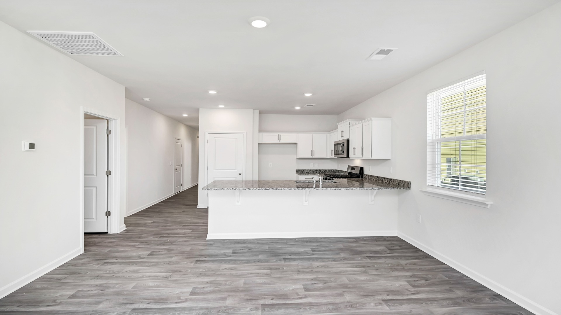 The dining and kitchen areas are open concept.