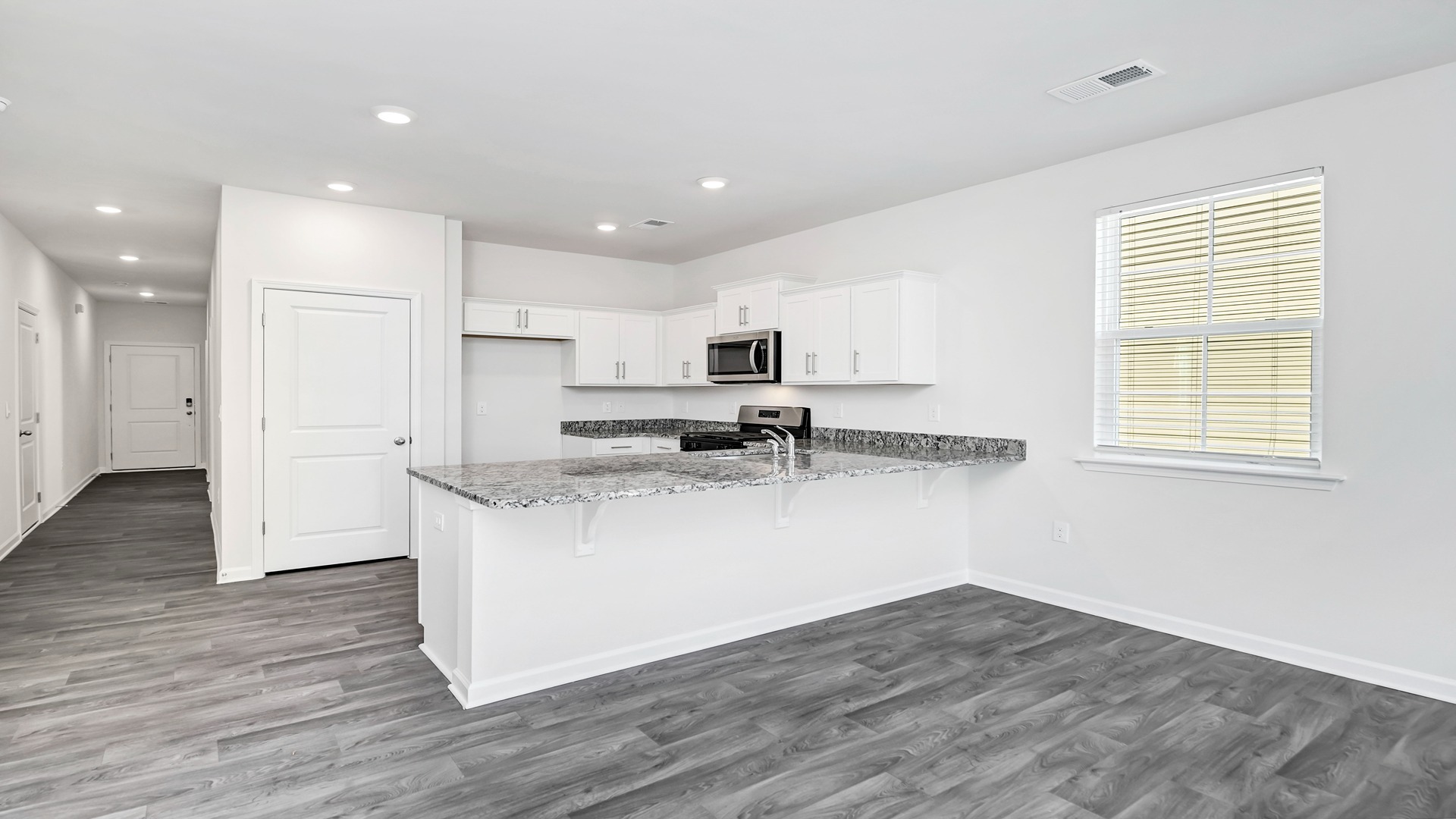 There is room for barstool seating at the floating kitchen island.