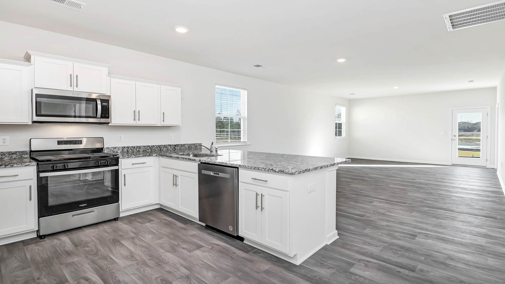 The dining and kitchen areas are open concept.