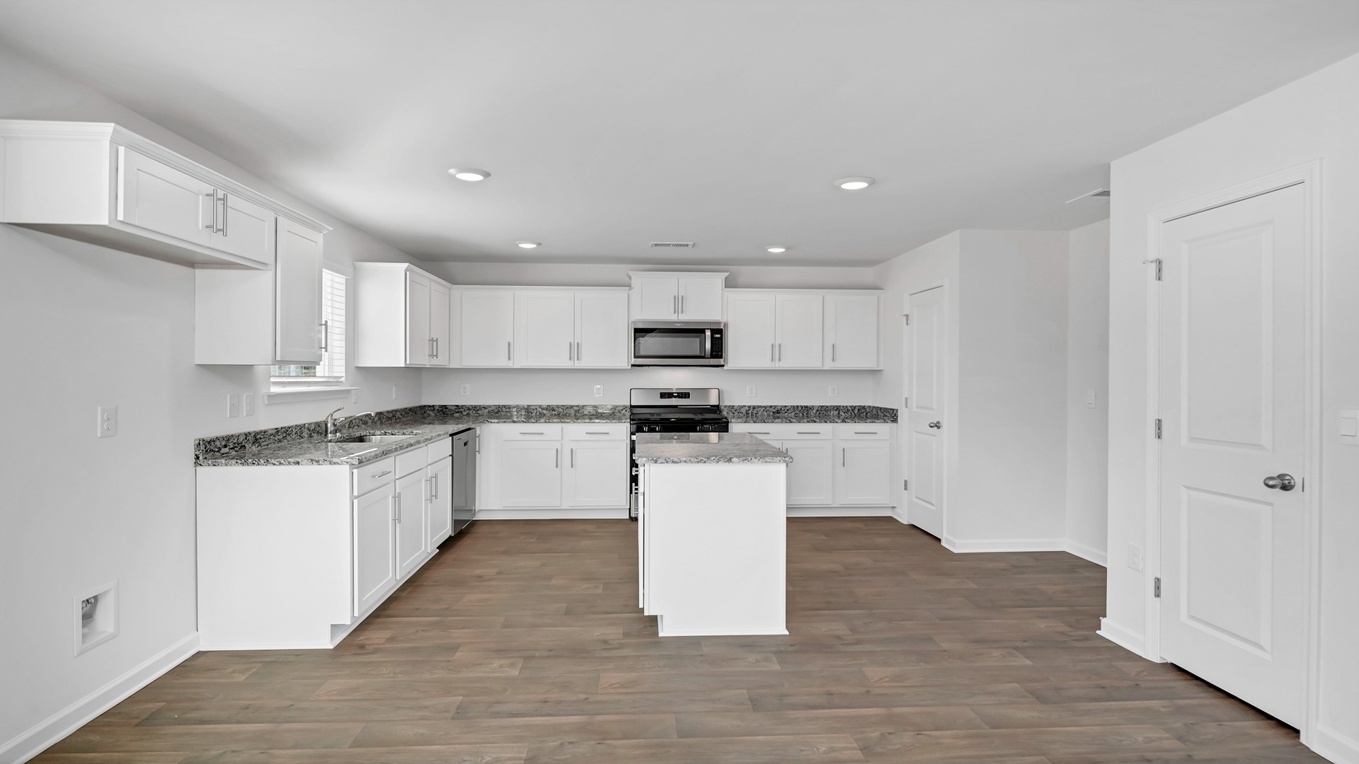 Living area leads to the kitchen and dining areas