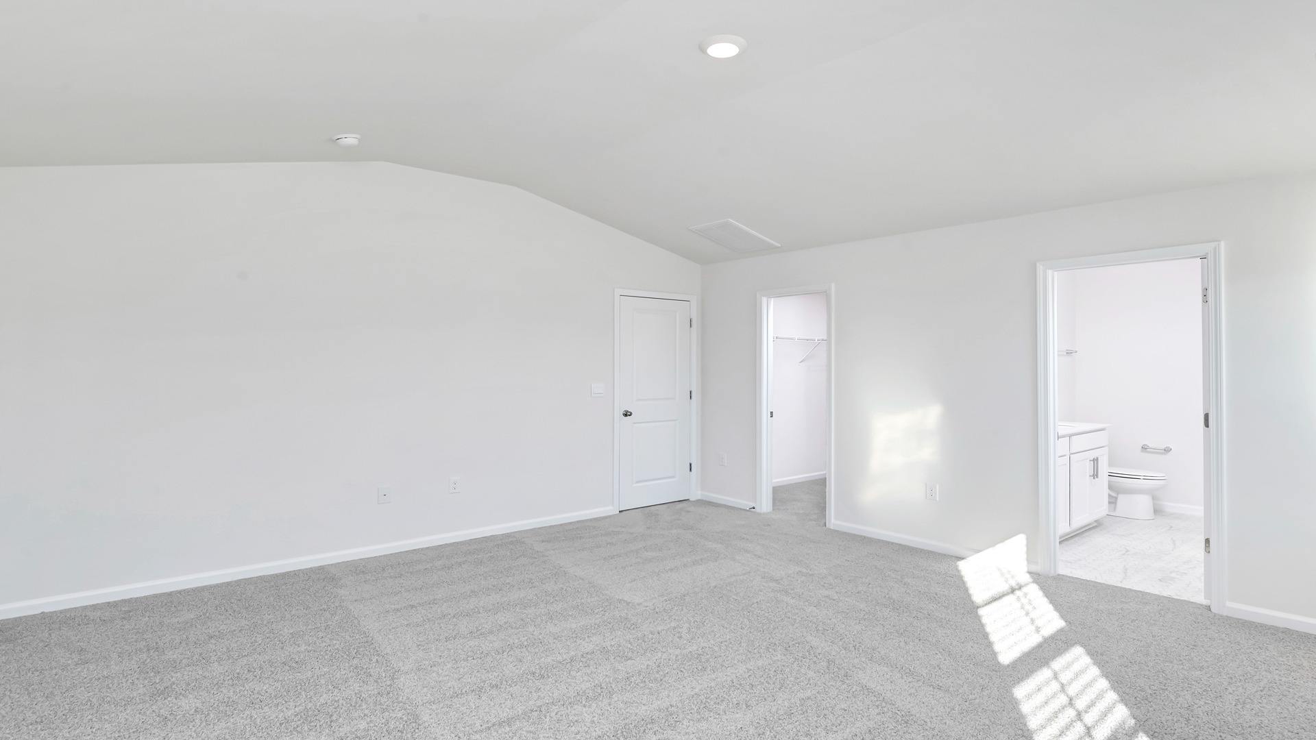 Primary bedroom upstairs with carpet flooring