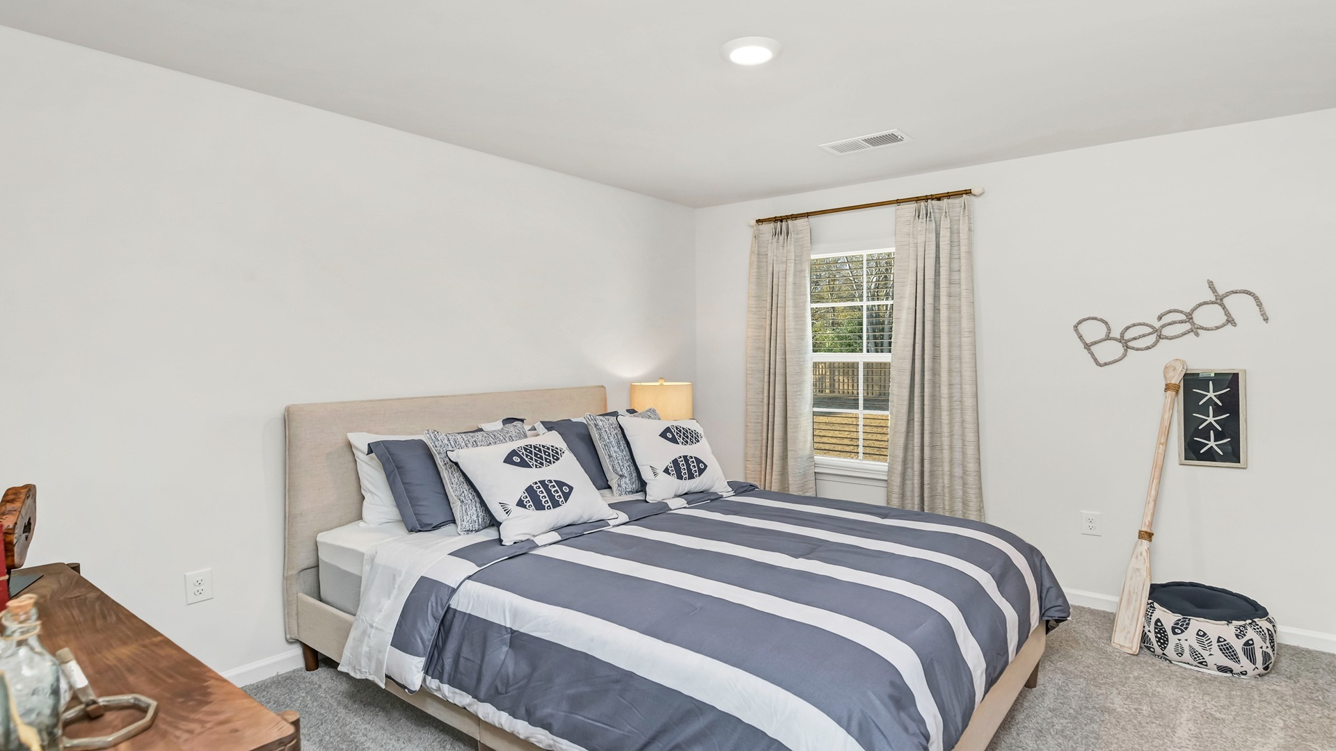 Bedroom 4 upstairs with a walk-in closet in new home in Mulberry Landing