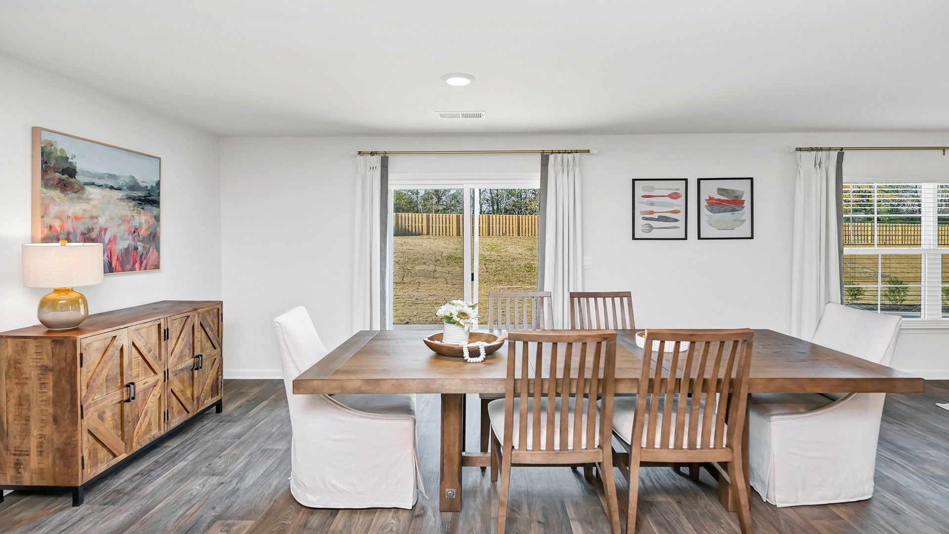 Dining area with several windows to allow natural light into the main, open living areas in the Aisle floor plan