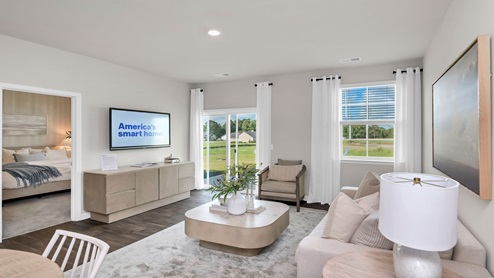 The living area features glass sliding doors that lead to the back patio.