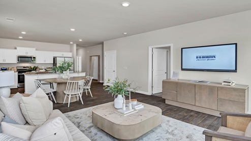 The living area has views of the dining and kitchen areas.