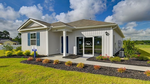 This model home features a glass storefront where the garage would normally be.