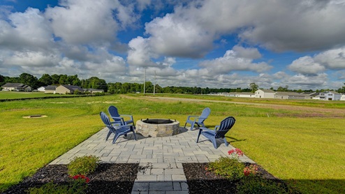 There is a paved back patio.