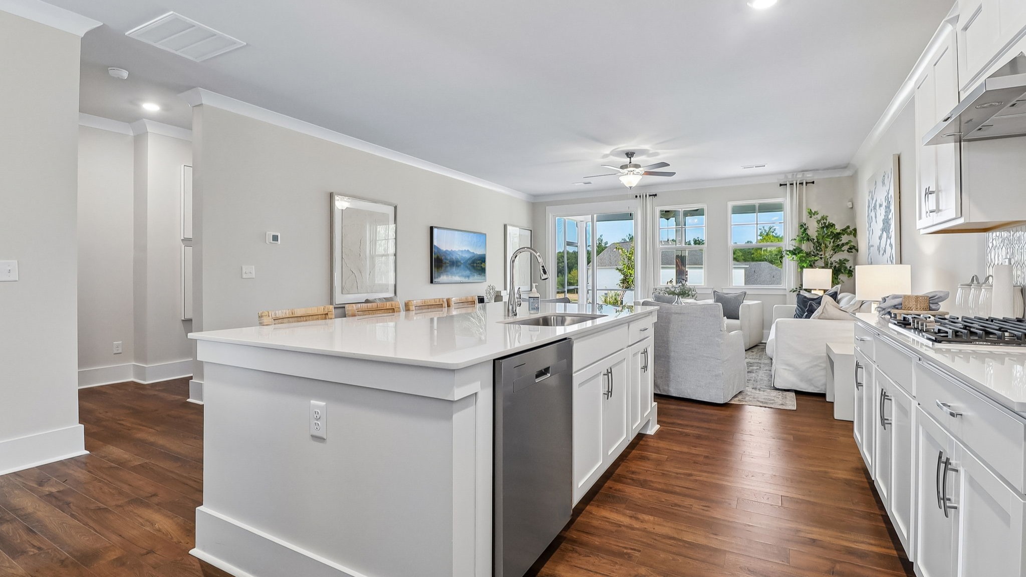 Large floating island and RevWood floors in the kitchen space