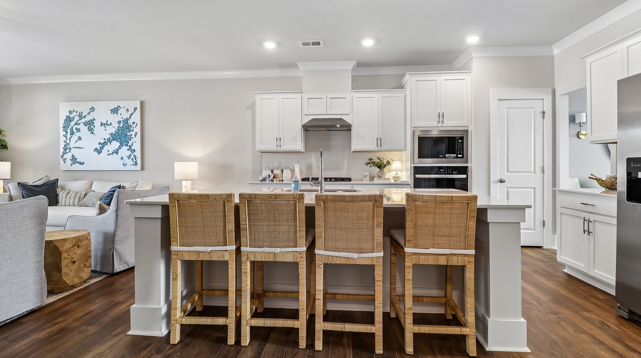 Modern kitchens in Shell Pointe with white quartz countertops and tile backsplash