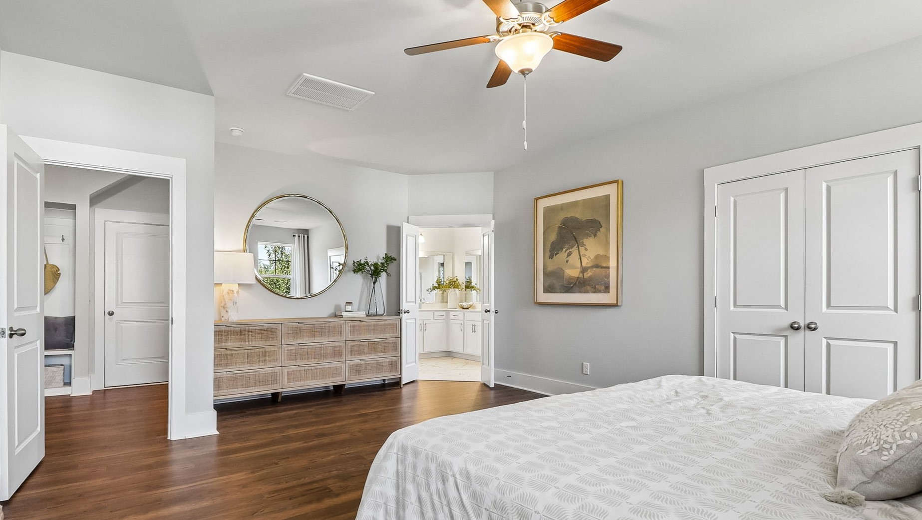 Primary bedroom on the first floor with lots of space and RevWood floors