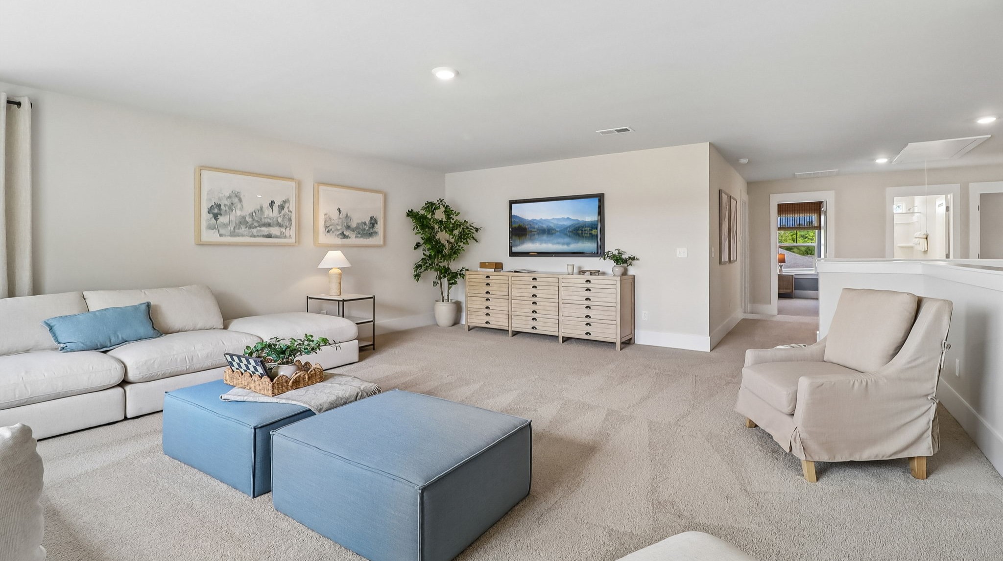 Large loft at the top of the stairs in new construction model home