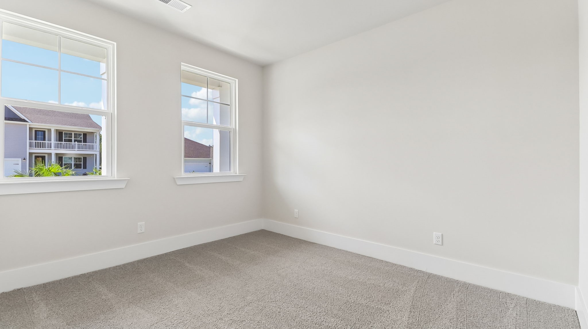 Front bedroom 2 with two windows for natural light in the bedroom