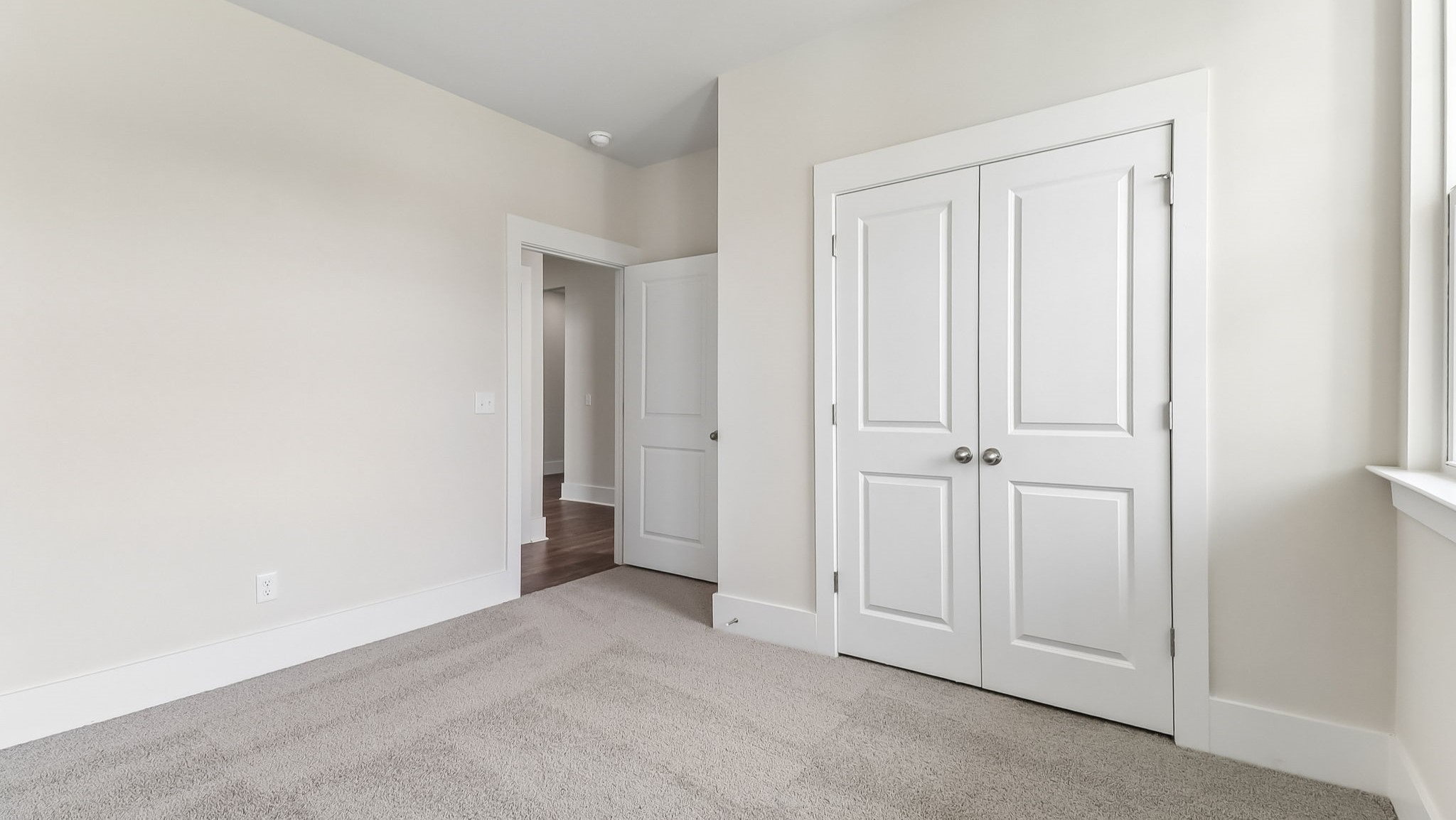 French closet doors in bedroom 2 of the Darby for sale near Lake Murray