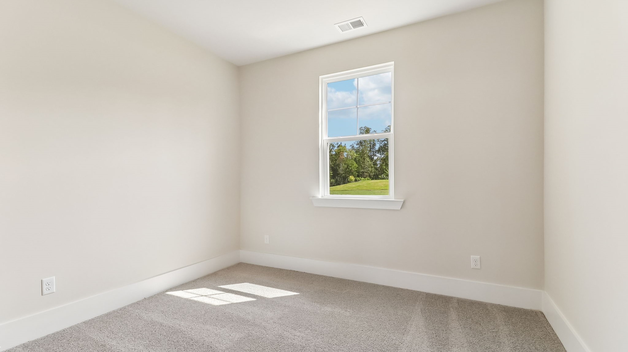 Bedroom 3 centrally located in the home with a window for light