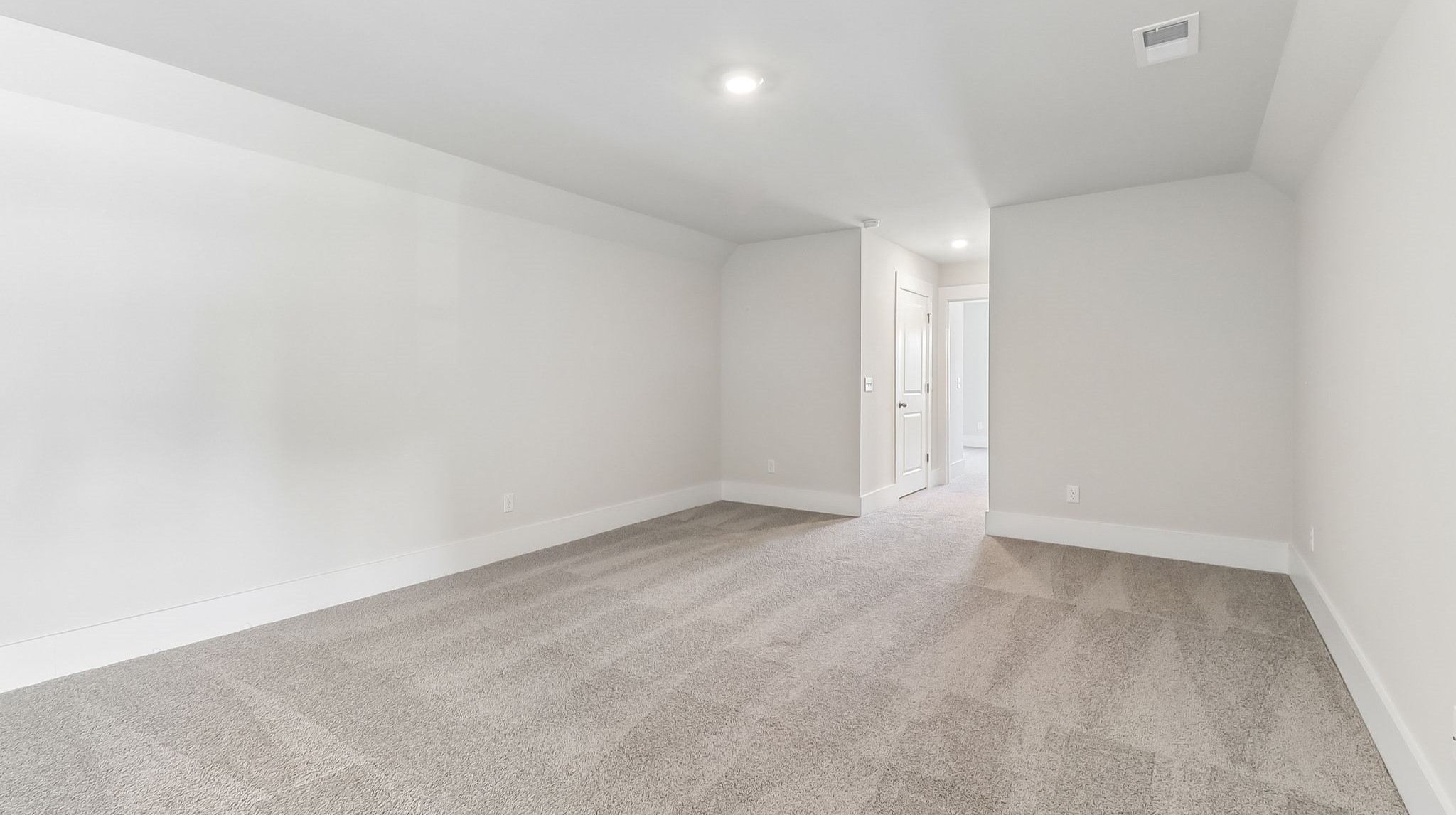 Large loft space upstairs with carpet floors