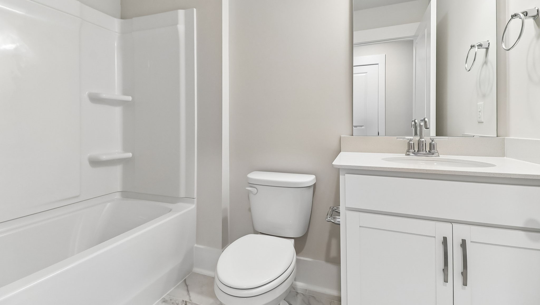 Bathroom 2 downstairs with shower tub and a single-sink vanity