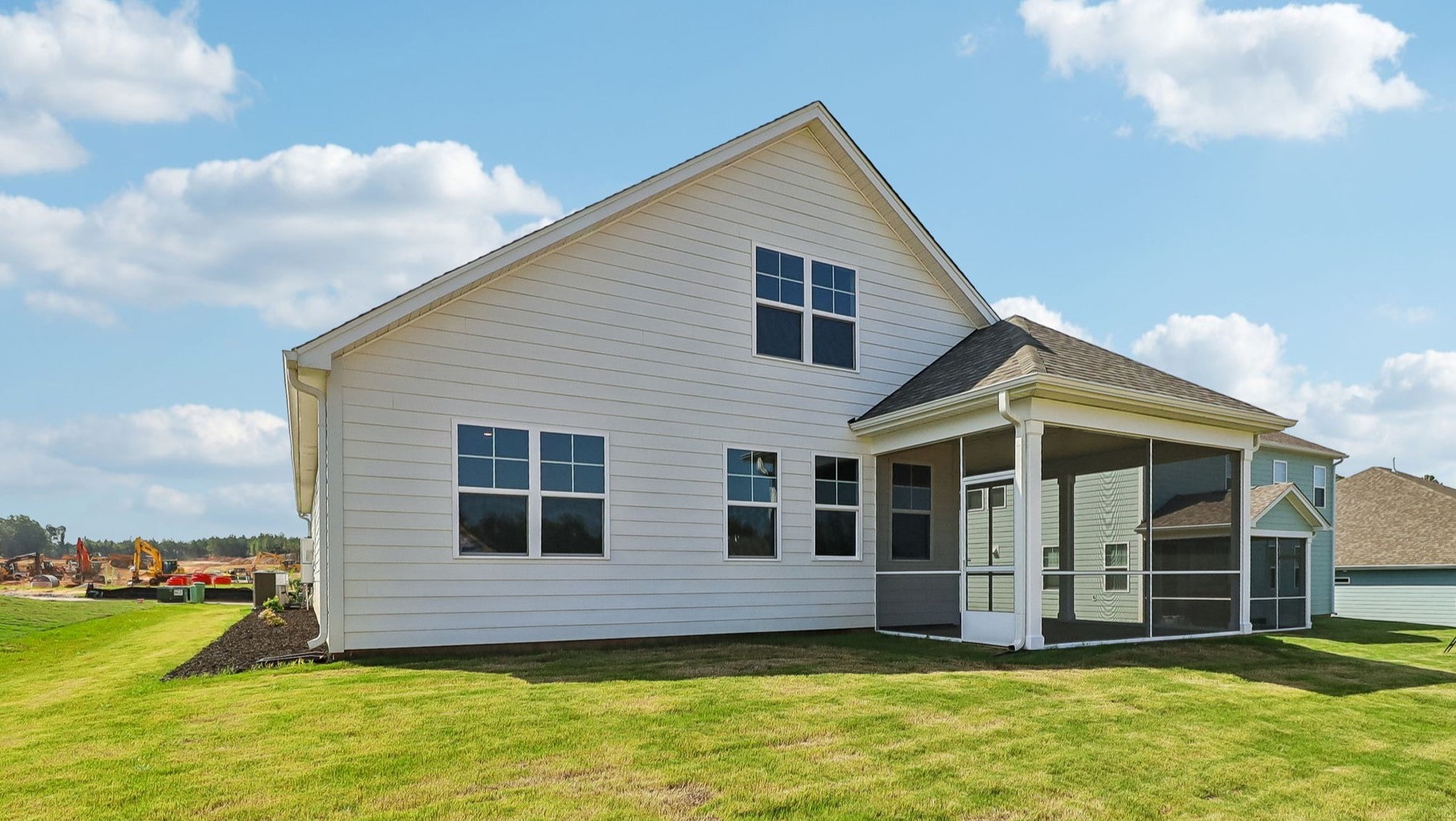 Back exterior of the home with off-white Hardie Plank siding