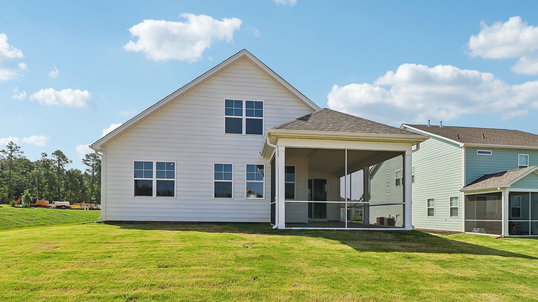 Covered, screened-in back patio is at the back of the home