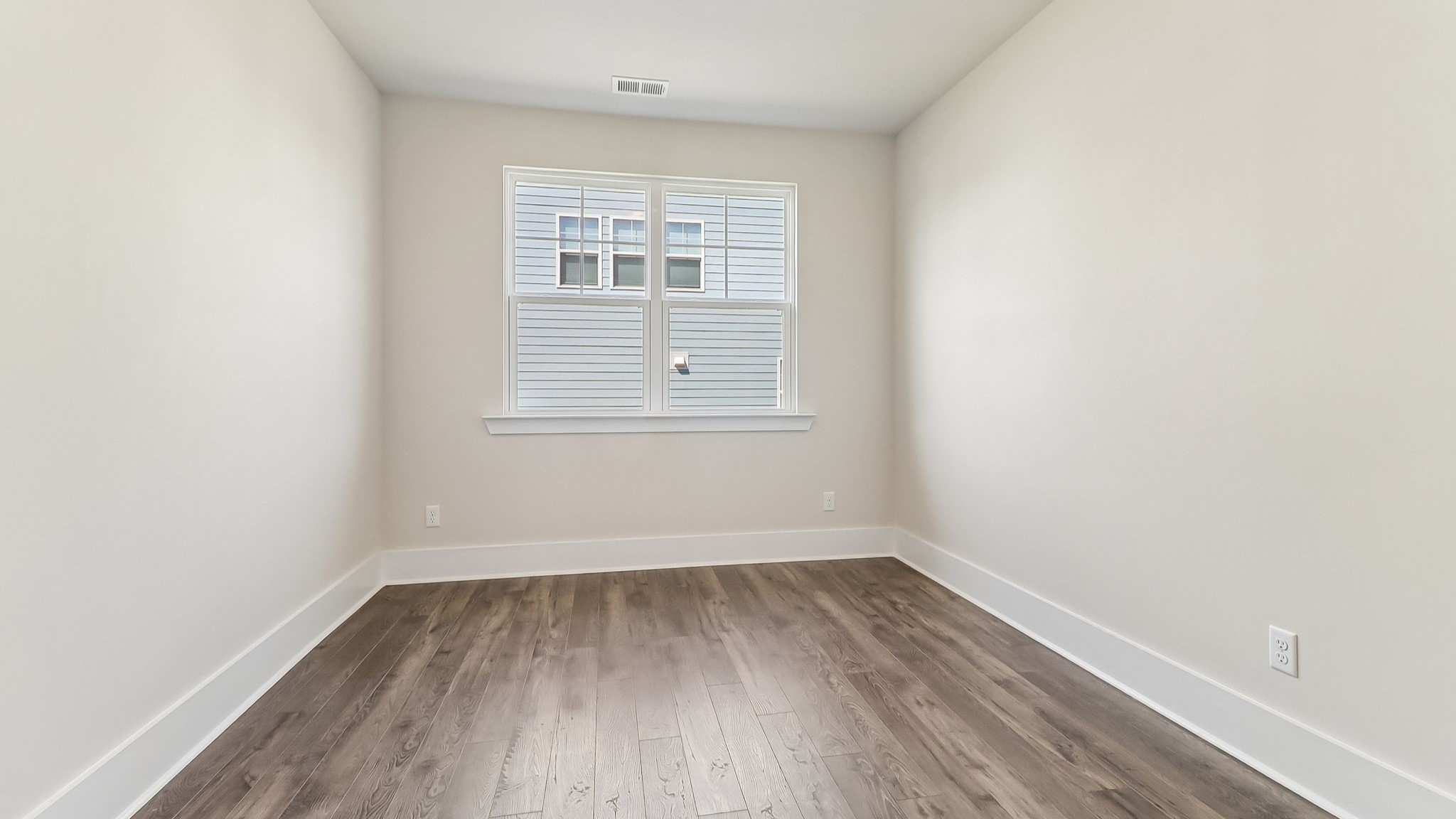Front flex space with window for light and RevWod floors