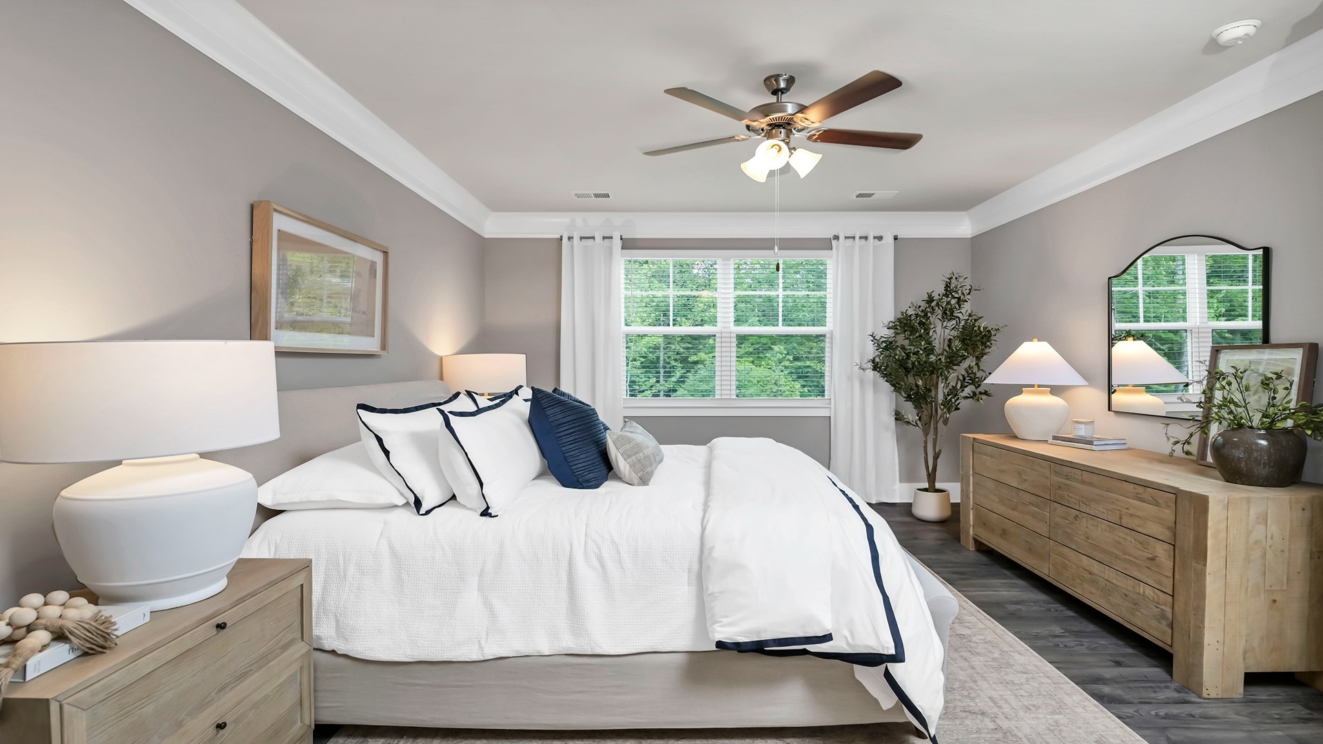 A king bed set comfortably fits in the primary bedroom