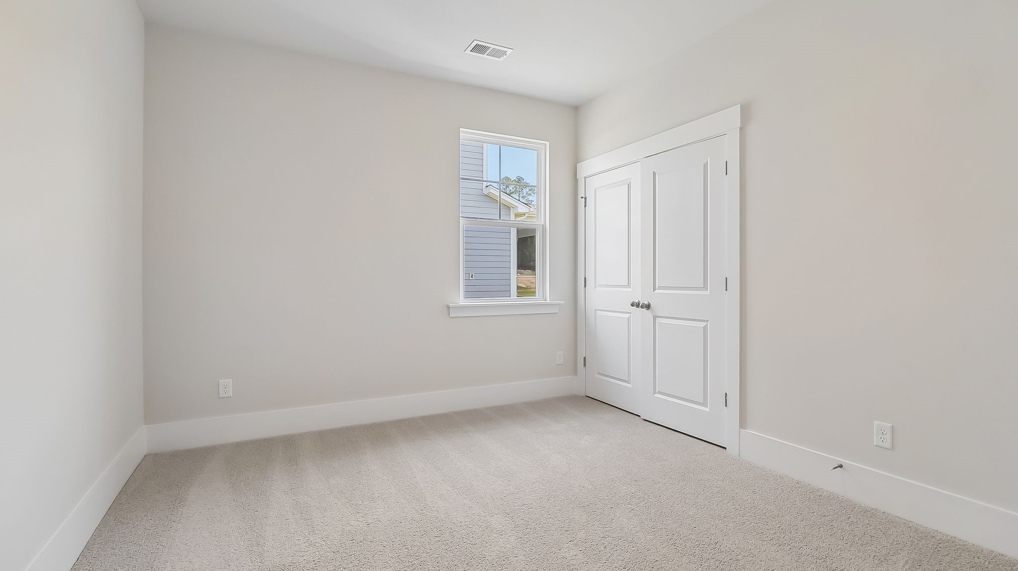 Bedroom 4 with a window and carpet flooring