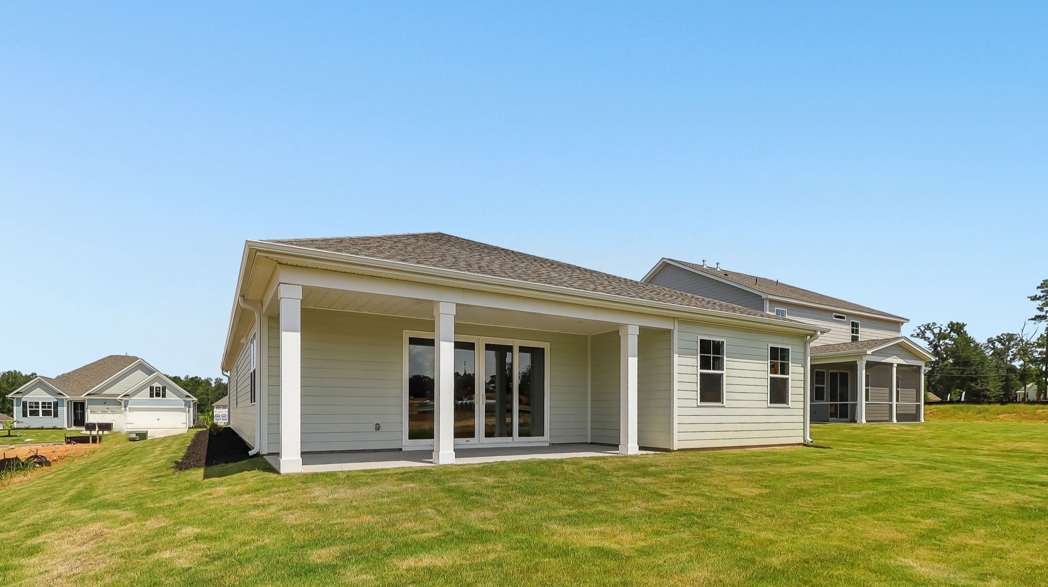 Back exterior of the home featuring a covered back patio