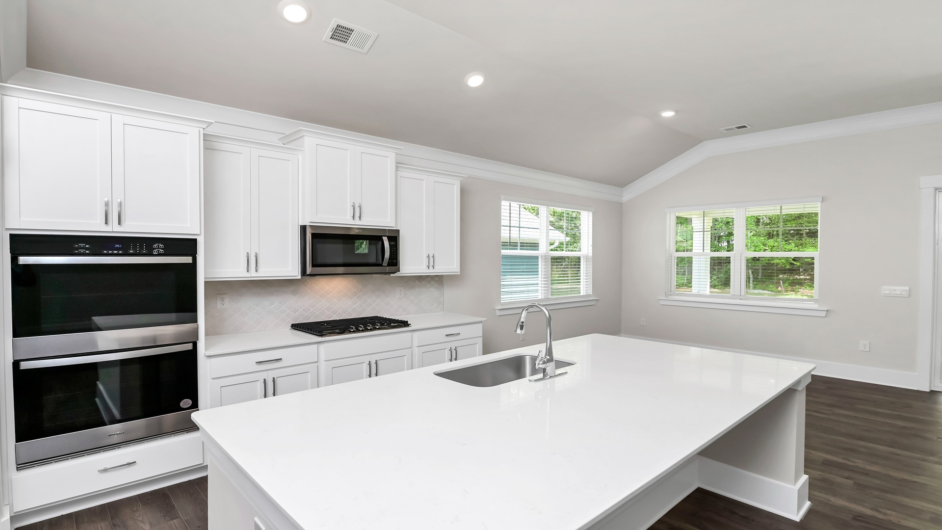 Sleek, white quartz countertops in the kitchen