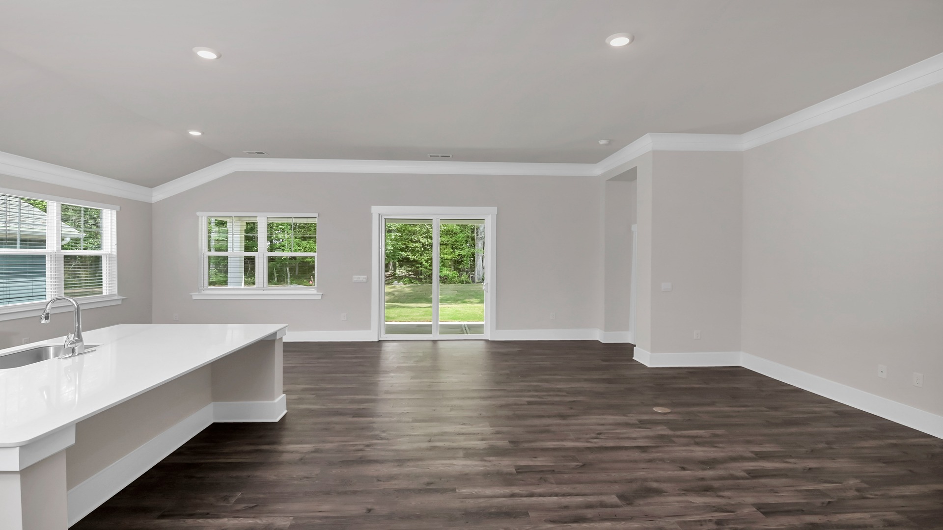 Open living and dining areas with RevWood flooring