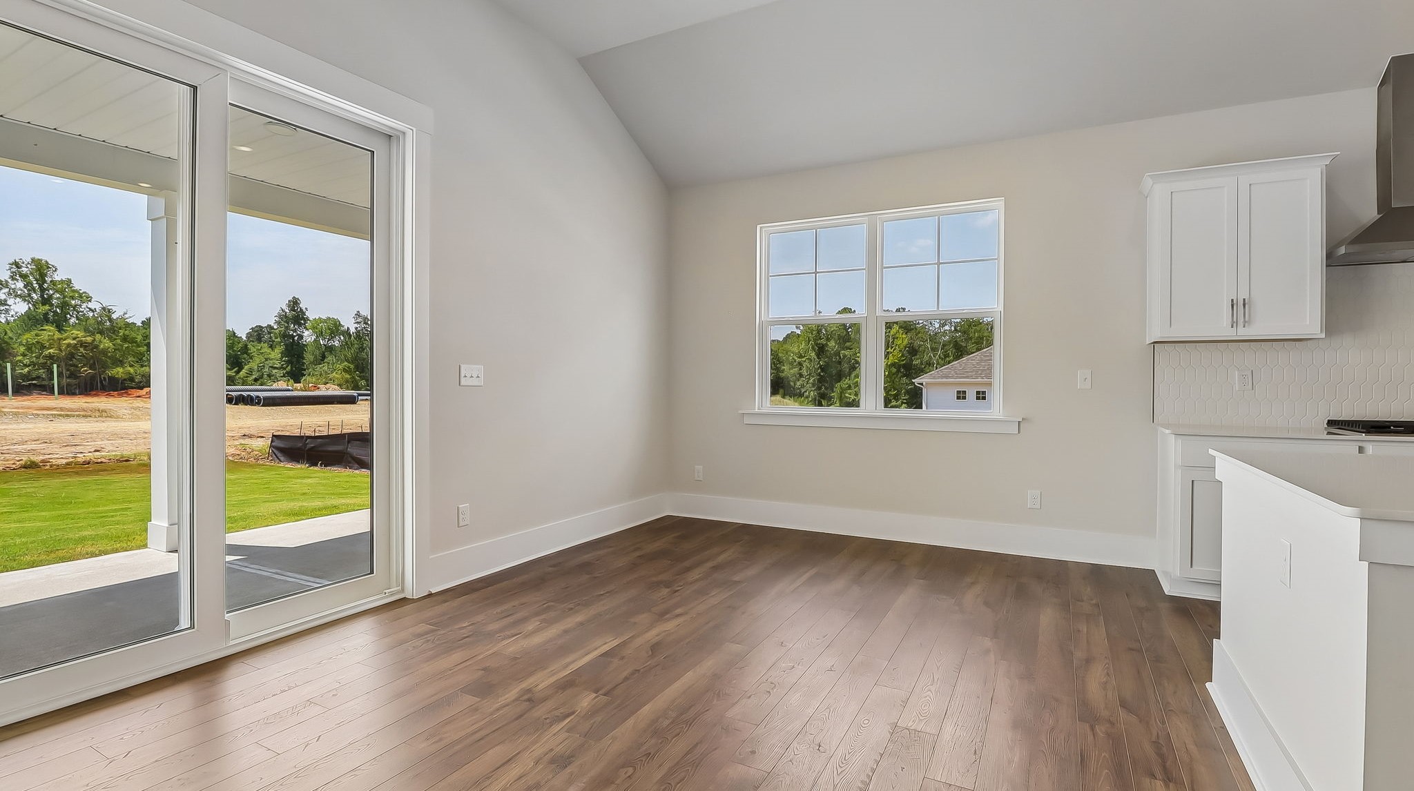 Access to back patio from dining/living area through sliding glass doors