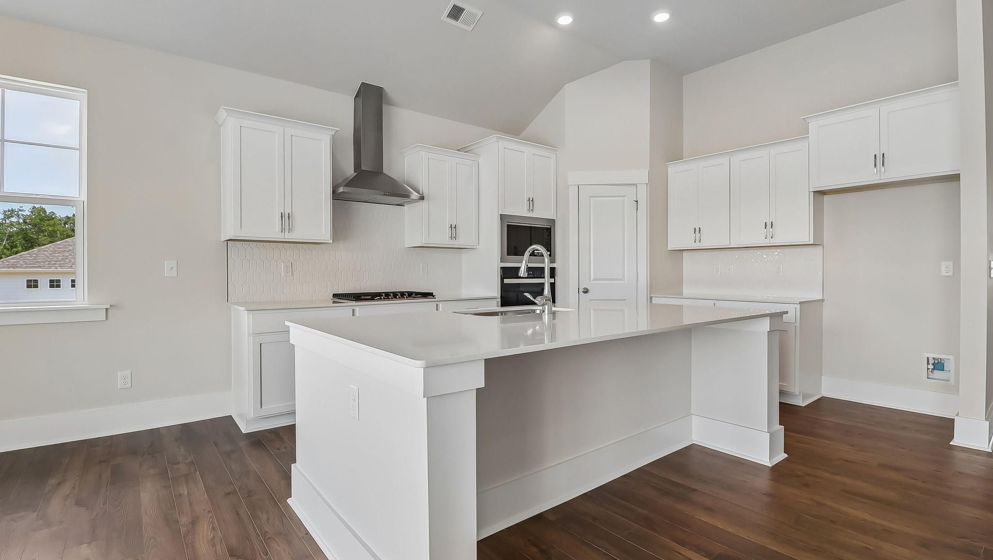Litchfield kitchen with white cabinetry and a corner pantry