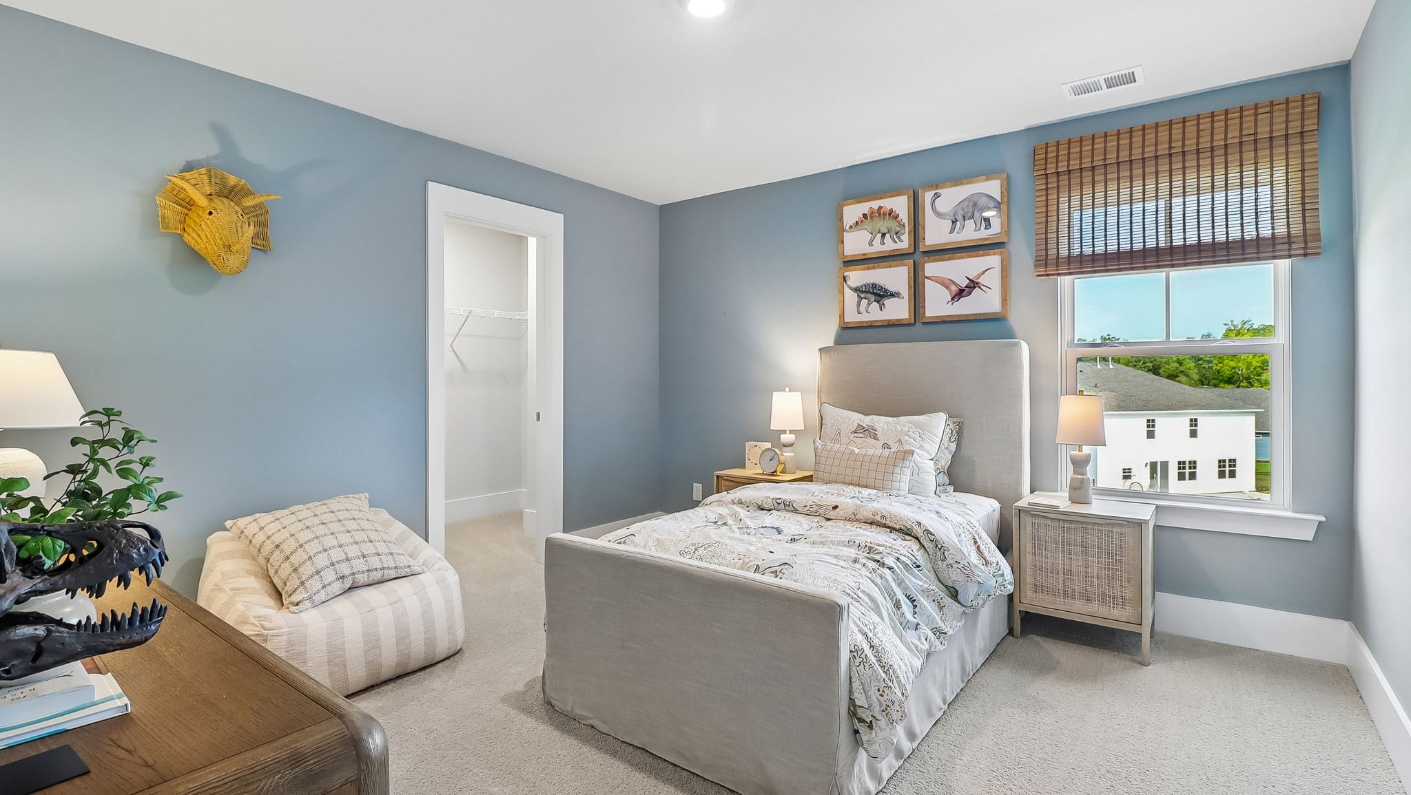 Bedroom 4 upstairs in the Tillman with a window for light and carpet flooring