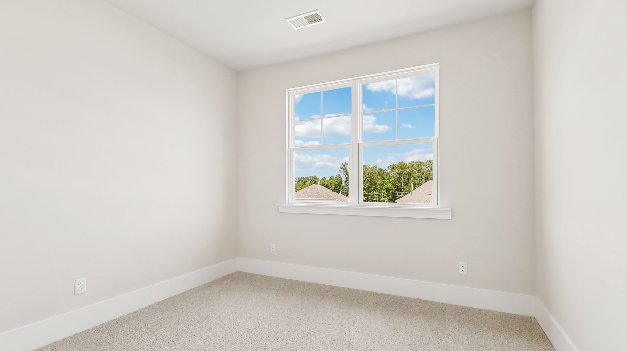 Back bedroom 3 with a large window facing the backyard in Shell Pointe