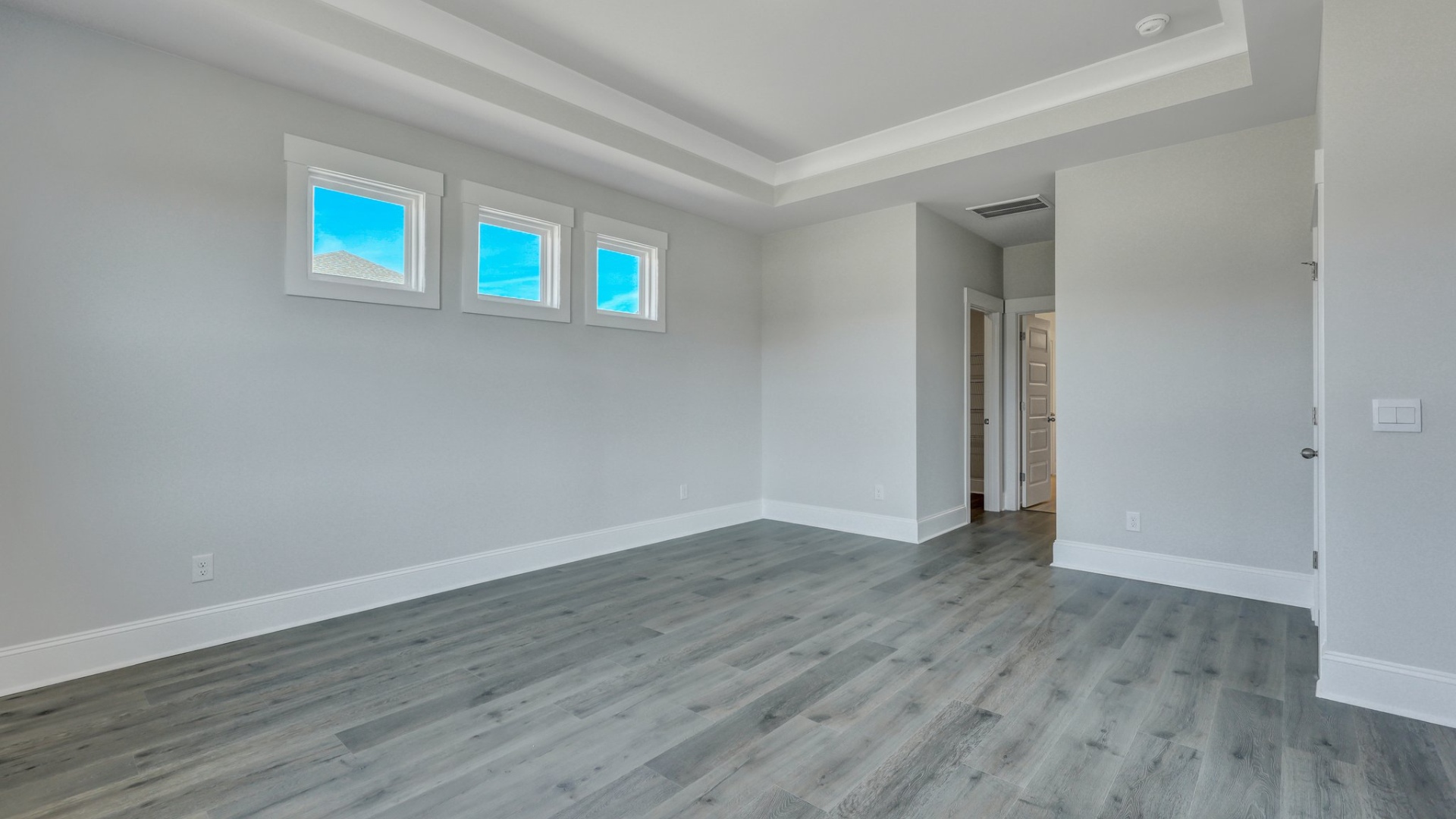 Lots of natural light in primary bedroom of home for sale near Lake Murray