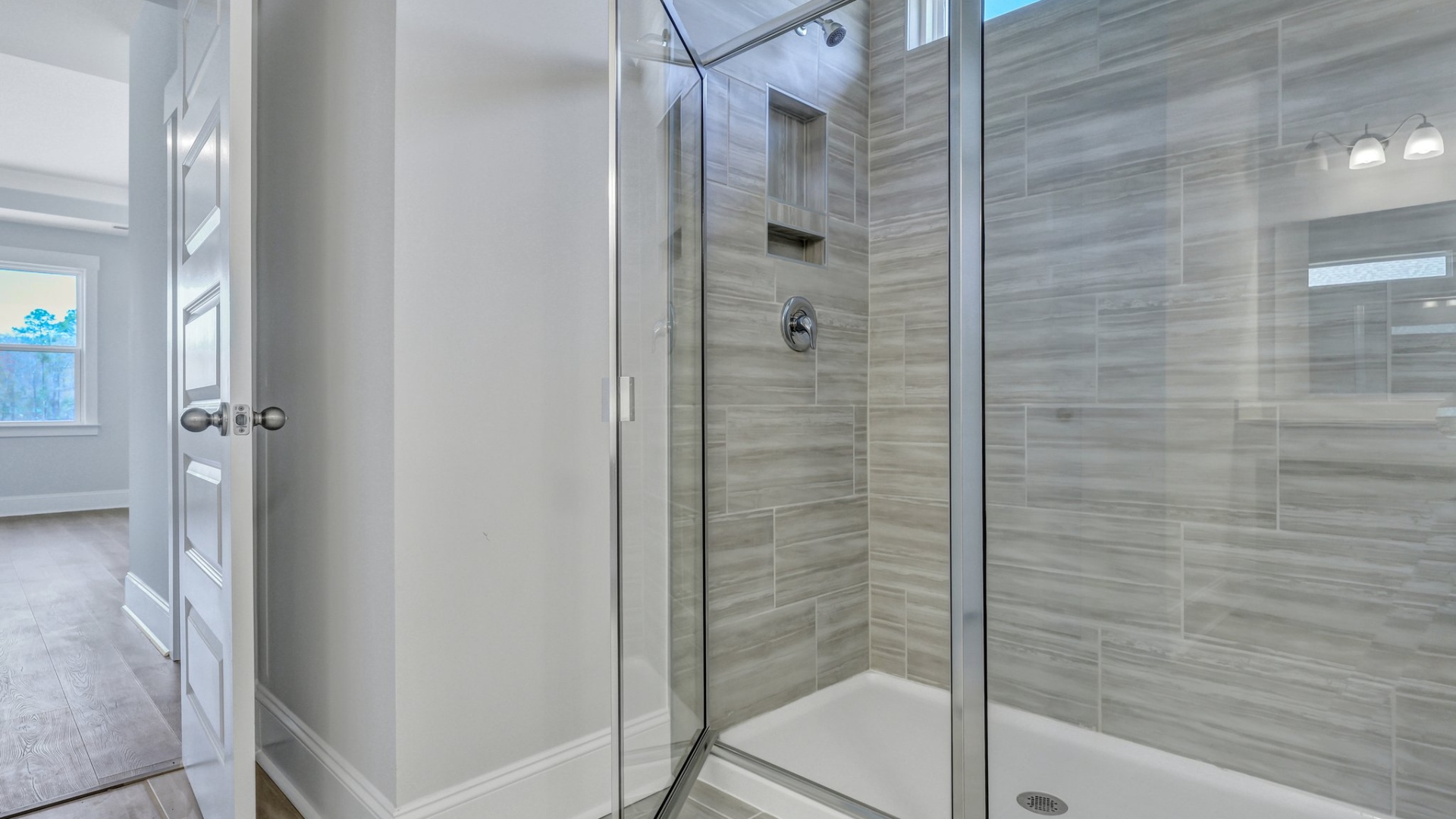 Standup primary shower in primary bathroom of home for sale in Shell Pointe
