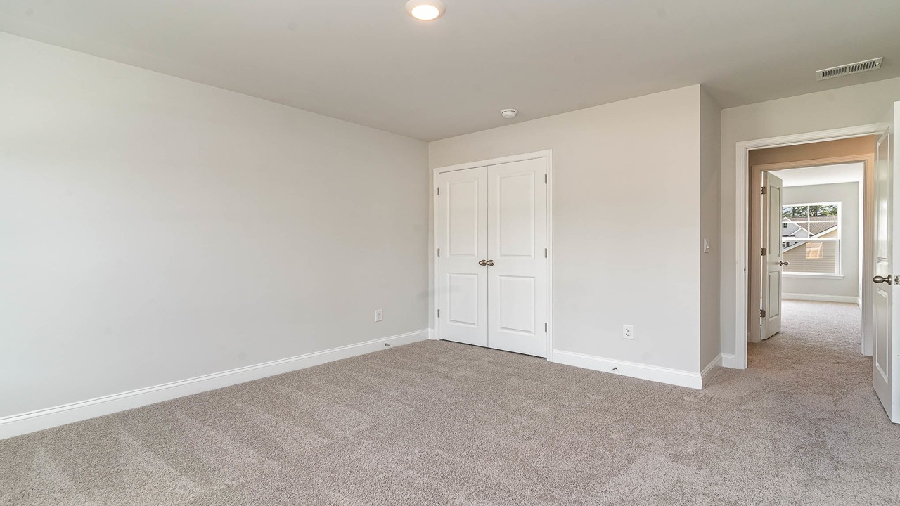 French closet doors in bedroom 4 of the Forrester Floorplan