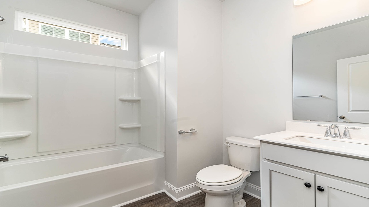 Bathroom 2 Downstairs with shower tub combo and quartz countertops