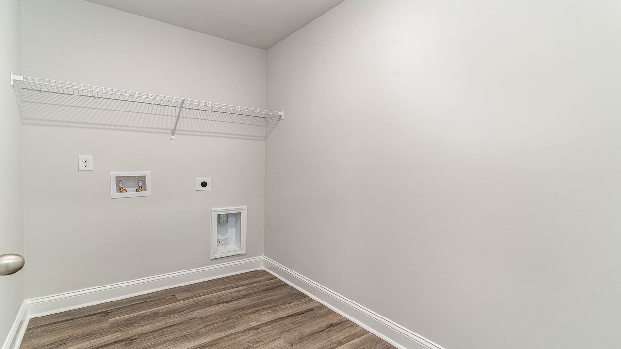 Laundry room upstairs with shelving above